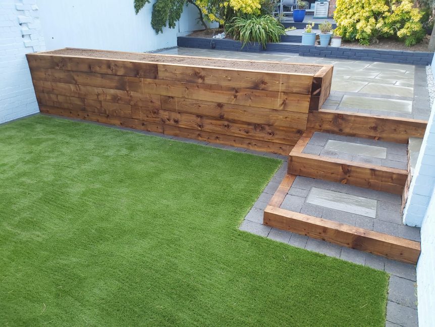 Completed garden with railway sleepers and artificial grass installation image 2b