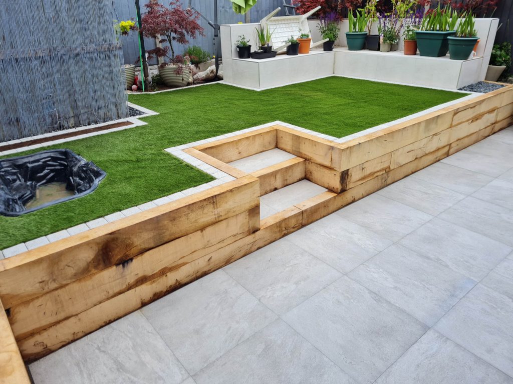 JD Landscapes Upper & Lower Tier Garden with Oak Timber Sleepers & Artificial Grass